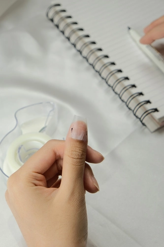 Mark your nails from side to side using a pen